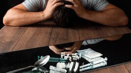 man-reaches-drugs-fight-against-drug-addiction.jpg
